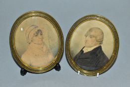 A PAIR OF EARLY 19TH CENTURY PORTRAIT MINIATURE WATERCOLOURS ON CARD OF A LADY AND GENTLEMAN, the