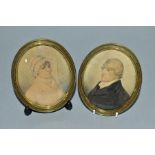 A PAIR OF EARLY 19TH CENTURY PORTRAIT MINIATURE WATERCOLOURS ON CARD OF A LADY AND GENTLEMAN, the