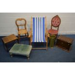 A BEECH FOLDING DECK CHAIR with stripped fabric, walnut balloon back caned chair, a reproduction