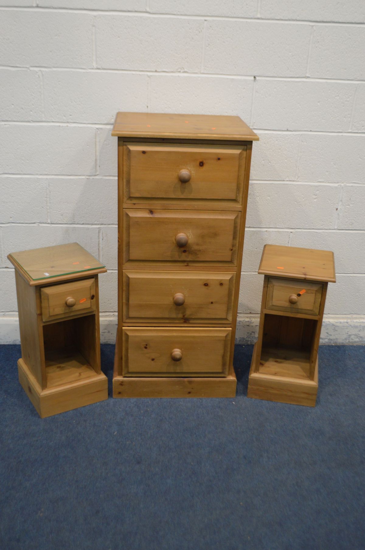 A PINE CHEST OF FOUR DEEP DRAWERS, width 53cm x depth 46cm x height 113cm together with a pair of