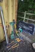 A QUANTITY OF GARDEN TOOLS, to include spades, forks, rakes, hedge cutters, etc, along with a