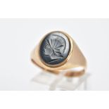 A 9CT GOLD GENTS HEMATITE INTAGLIO SIGNET RING, of an oval form depicting a Roman soldier, plain