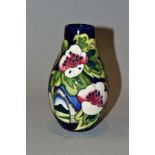 A MOORCROFT POTTERY LIMITED EDITION VASE, Pears and Flowers designed and signed by Emma Bossons,