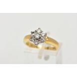 AN 18CT GOLD DIAMOND CLUSTER RING, flower shaped slightly raised cluster, set with seven claw set,