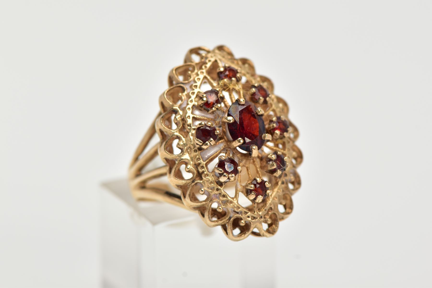 A 9CT GOLD GARNET RING, of an openwork lozenge form, set with a central oval cut garnet and circular - Image 4 of 4