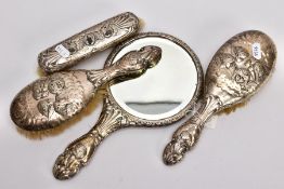 AN EARLY GEORGIAN STYLE FOUR PIECE SILVER VANITY SET, to include two hairbrushes, a clothes brush