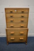 A MID 20TH CENTURY GOLDEN OAK ARTS AND CRAFTS STYLE CHEST OF TWO SHORT OVER FIVE GRADUATING DRAWERS,