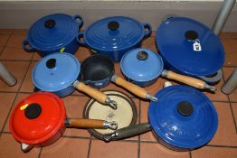 A COLLECTION OF MOSTLY BLUE LE CREUSET ENAMELLED CAST IRON COOKWARE AND OTHER FRENCH CAST IRON