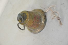 A BRASS PUBLIC HOUSE BELL advertising Golden Bitter engraved on it, 15cm in diameter