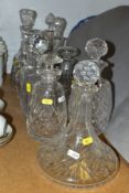 A GROUP OF TEN ASSORTED DECANTERS, including a Stuart cut glass decanter, a cut glass ships