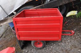 A RED RIDE ON LAWNMOWER GRASS TIPPING TRAILER