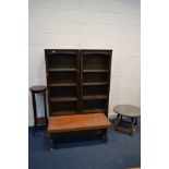 A PAIR OF DARK OAK OPEN BOOKCASES with four shelves together with a pine and copper coffee table (