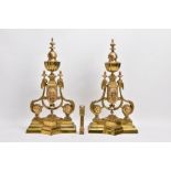A PAIR OF BRASS FENDER ENDS with lions head motifs, height 45cm, paired with a Victorian brass