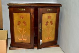 AN EARLY 20TH CENTURY MAHOGANY, STAINED AND INLAID SMOKERS CABINET, the hinged top above double