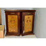 AN EARLY 20TH CENTURY MAHOGANY, STAINED AND INLAID SMOKERS CABINET, the hinged top above double