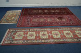 A PAIR OF WOOLLEN ANTIQUE ROYAL RED GROUND RUNNERS 82cm x 248cm, a woollen red runner and 67cm x