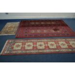 A PAIR OF WOOLLEN ANTIQUE ROYAL RED GROUND RUNNERS 82cm x 248cm, a woollen red runner and 67cm x