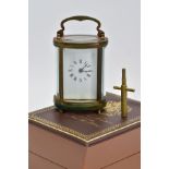 A MINIATURE BRASS, FIVE GLASS OVAL CARRIAGE CLOCK, French mechanical key wound movement, enamel