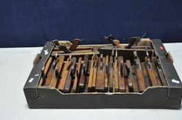 A TRAY CONTAINING TWENTY FIVE VINTAGE WOODEN MOULDING PLANES