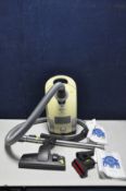 A MIELE S4210 PULL ALONG VACUUM CLEANER with two spare nozzles and two bags (PAT pass and working)