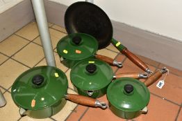 A LE CREUSET GRADUATED SET OF FOUR GREEN ENAMEL CAST IRON SAUCEPANS AND MATCHING FRYING PAN,