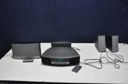 A BOSE WAVE MUSIC SYSTEM AWRCC5 with remote, a Wave DAB Module, a Sound Dock Music system (powers up