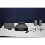 A BOSE WAVE MUSIC SYSTEM AWRCC5 with remote, a Wave DAB Module, a Sound Dock Music system (powers up