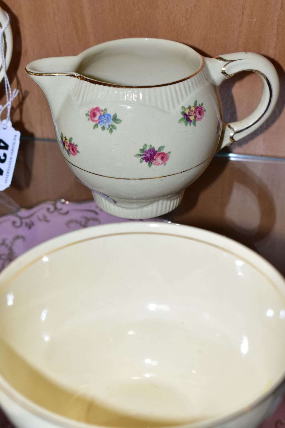 A CLARICE CLIFF NEWPORT POTTERY PART TEA SET, transfer printed with floral sprays, Reg no 840076, - Image 3 of 8