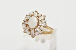 A 9CT GOLD OPAL CLUSTER RING, centring on an oval cabochon opal, within a surround of circular cut