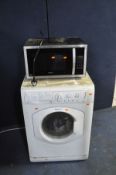 A HOTPOINT WDL 520 P WASHER DRYER (needs a clean) and a Kenwood Microwave (both PAT pass , washer
