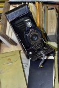 A KODAK NO.2A FOLDING AUTOGRAPHIC BROWNIE CAMERA, in distressed condition, with an old leather