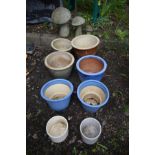 EIGHT VARIOUS GLAZED PLANT POTS, along with three graduated composite garden mushrooms, a wrought