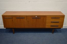 A MID 20TH CENTURY TEAK SIDEBOARD, with double cupboard doors, and three drawers flanking a fall