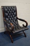 A BLACK FAUX LEATHER BUTTONED AND MAHOGANY SLIPPER ARMCHAIR