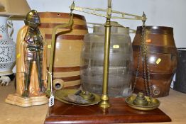 THREE EARTHENWARE BARRELS, a glass barrel, a set of brass weighing scales on mahogany stand,