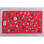 A TRAY OF ASSORTED SILVER AND WHITE METAL CHARMS, sixty three charms in total such as a silver