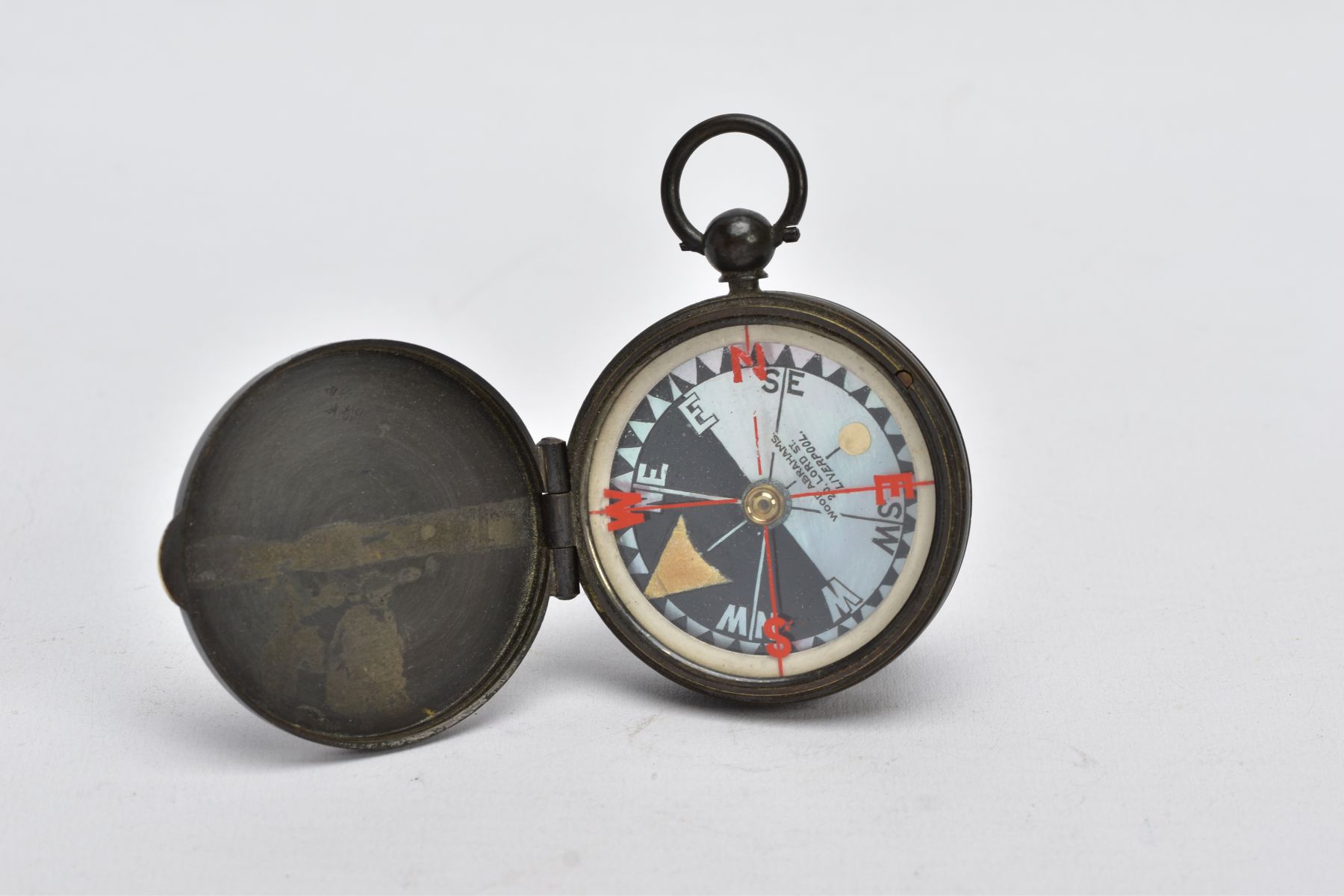 A 'WOOD ABRAHAMS' COMPASS, base metal compass, round mother of pearl dial, signed 'Wood Abrahams