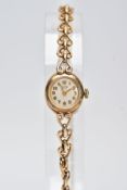 A 9CT GOLD HAND WOUND ROLEX TUDOR LADY'S WRISTWATCH, a round case measuring approximately 15mm in