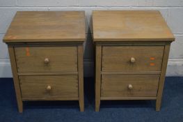 A PAIR OF NATURAL OAK TWO DRAWER BED SIDE CABINETS, width 50cm x depth 46cm x height 61cm