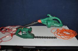A BLACK AND DECKER LEAF BLOWER (PAT pass and working) and a Qualcast Hedge Trimmer (PAT fail due