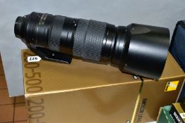 A BOXED NIKON AF-S NIKKOR 200-500mm f5.6 zoom lens, fitted with a Nikon 95mm neutral colour