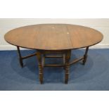 A MID TO LATE 20TH CENTURY OAK OVAL GATE LEG TABLE, open length 179cm x depth 121cm x closed