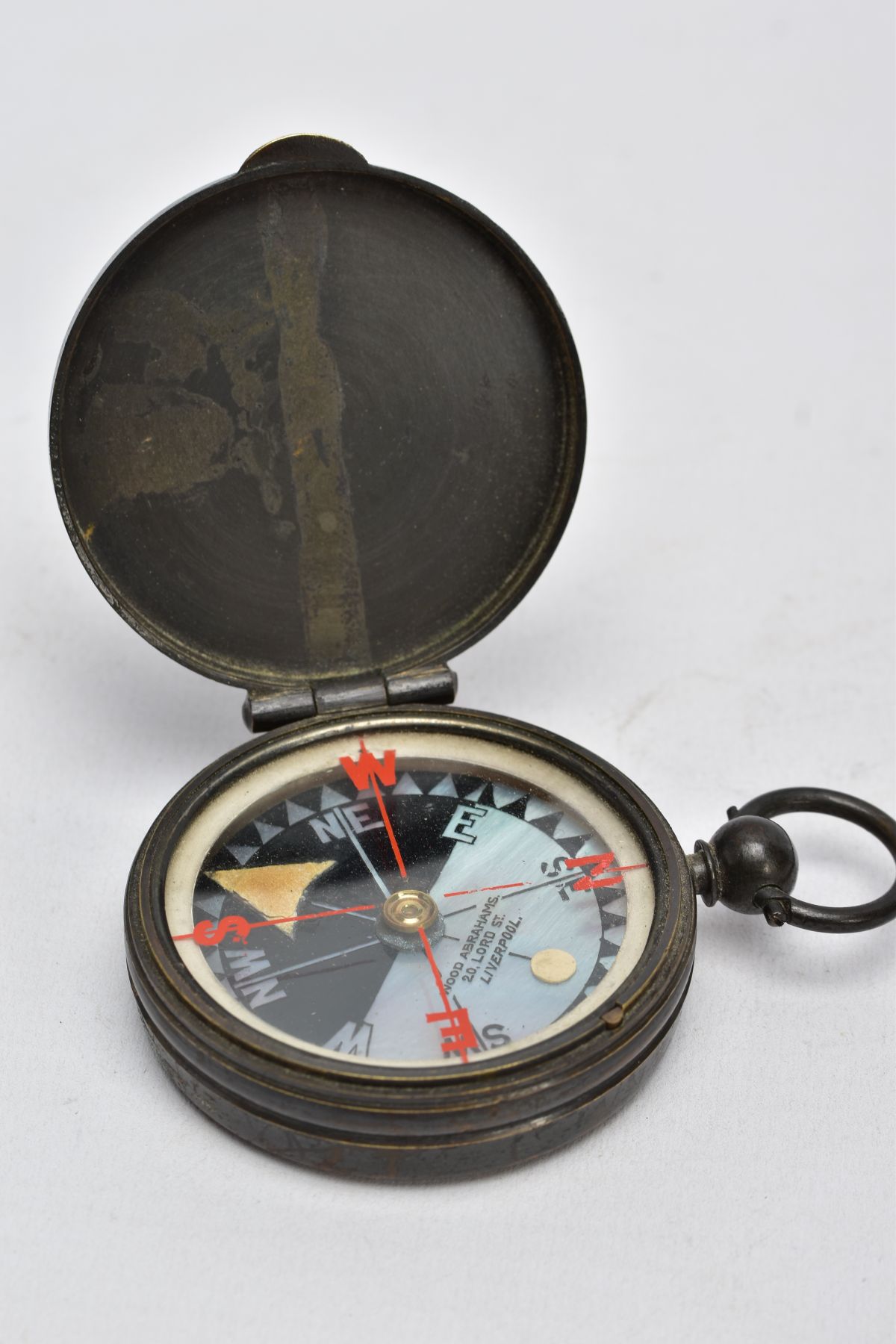 A 'WOOD ABRAHAMS' COMPASS, base metal compass, round mother of pearl dial, signed 'Wood Abrahams - Image 2 of 5