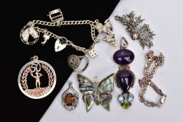 A BAG OF SILVER AND WHITE METAL ITEMS, to include a silver charm bracelet, suspending six charms