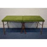 A GREEN UPHOLSTERED FOLDING MASSAGING TABLE