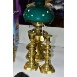 A TWIN BURNER BRASS OIL LAMP HAVING ETCHED GLASS WITH CRANBERRY GLASS FRILLED SHADE, including