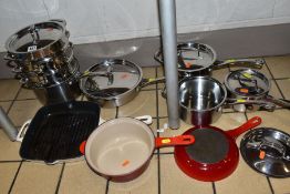 A SET OF LE CREUSET STAINLESS STEEL COOKWARE AND THREE PIECES OF ENAMELLED COOKWARE, comprising a Le