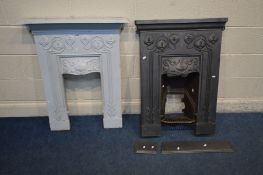 TWO SLIM MATCHING ART NOUVEAU CAST IRON FIRE PLACES, one painted pale blue, the other black (black