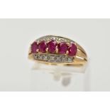 A 9CT GOLD RUBY AND DIAMOND RING, of a half hoop design, set with a row of five raised, oval cut