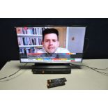 A SAMSUNG T32E310EX 32in TV with remote and an LG Blu ray player (disc error) (both PAT pass and